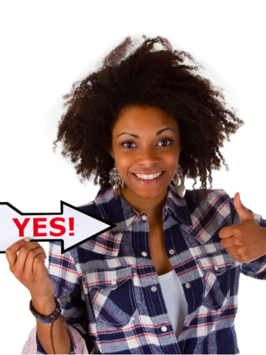 Woman holding a YES sign and giving a thumbs-up, illustrating people-pleasing and the difficulty of setting boundaries.